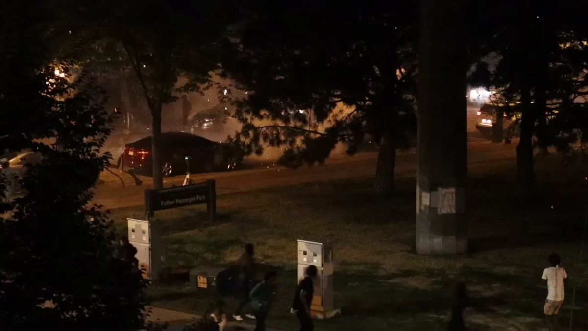 Fireworks explode by cars, people in downtown Minneapolis Bring Me